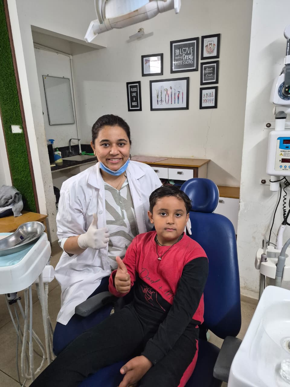 Dr. Keyuri Vamja with a happy young patient at Sudant Dental Clinic, Rajkot